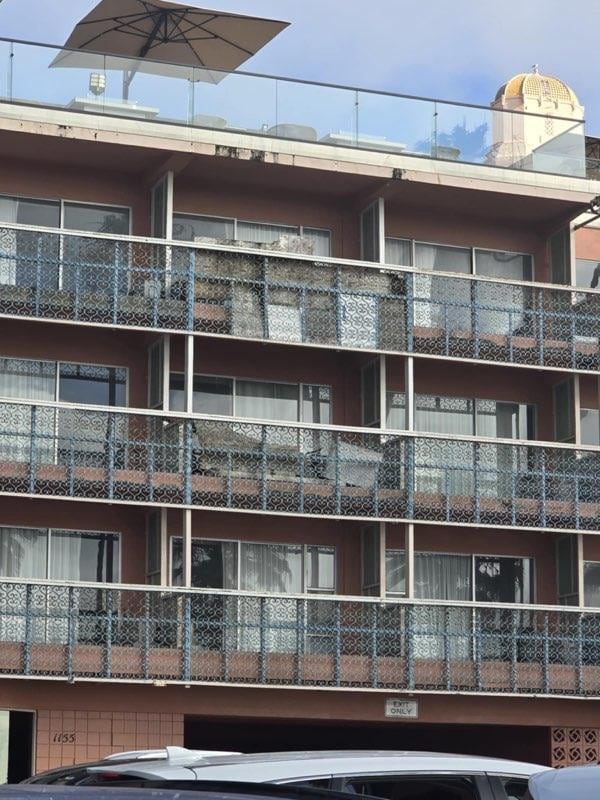 This is the balconies for the Cove building. Rusted metal work, 2x4 handrails that have termite damage and pieces of plywood. Very unsightly.