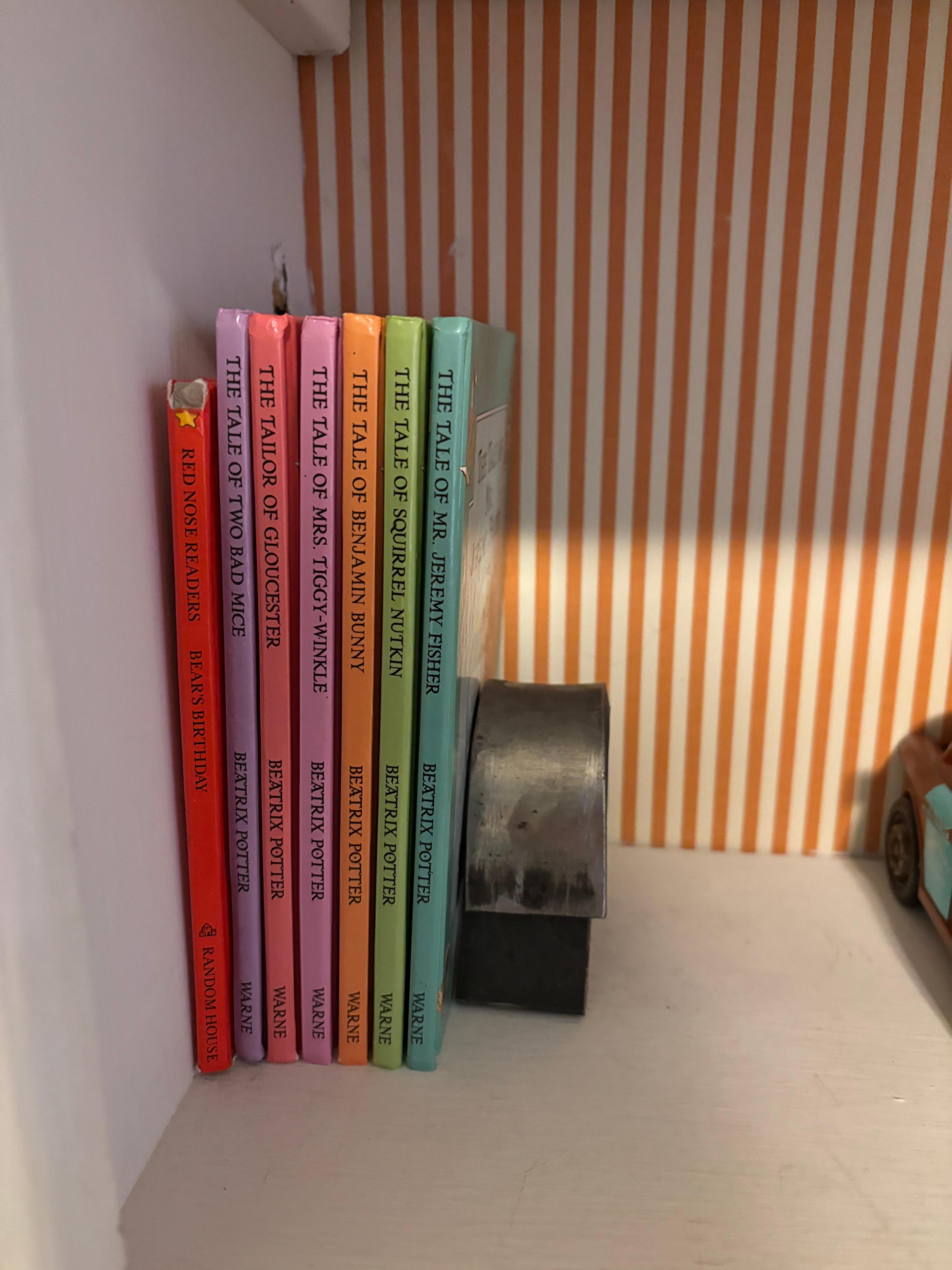 The front bedroom has a sweet collections of children’s books, including some picture books. 
