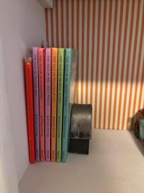 The front bedroom has a sweet collections of children’s books, including some picture books.