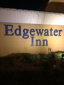 The sign lit up at night.