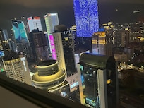 View at night of Chongqing out my rooms glass wall