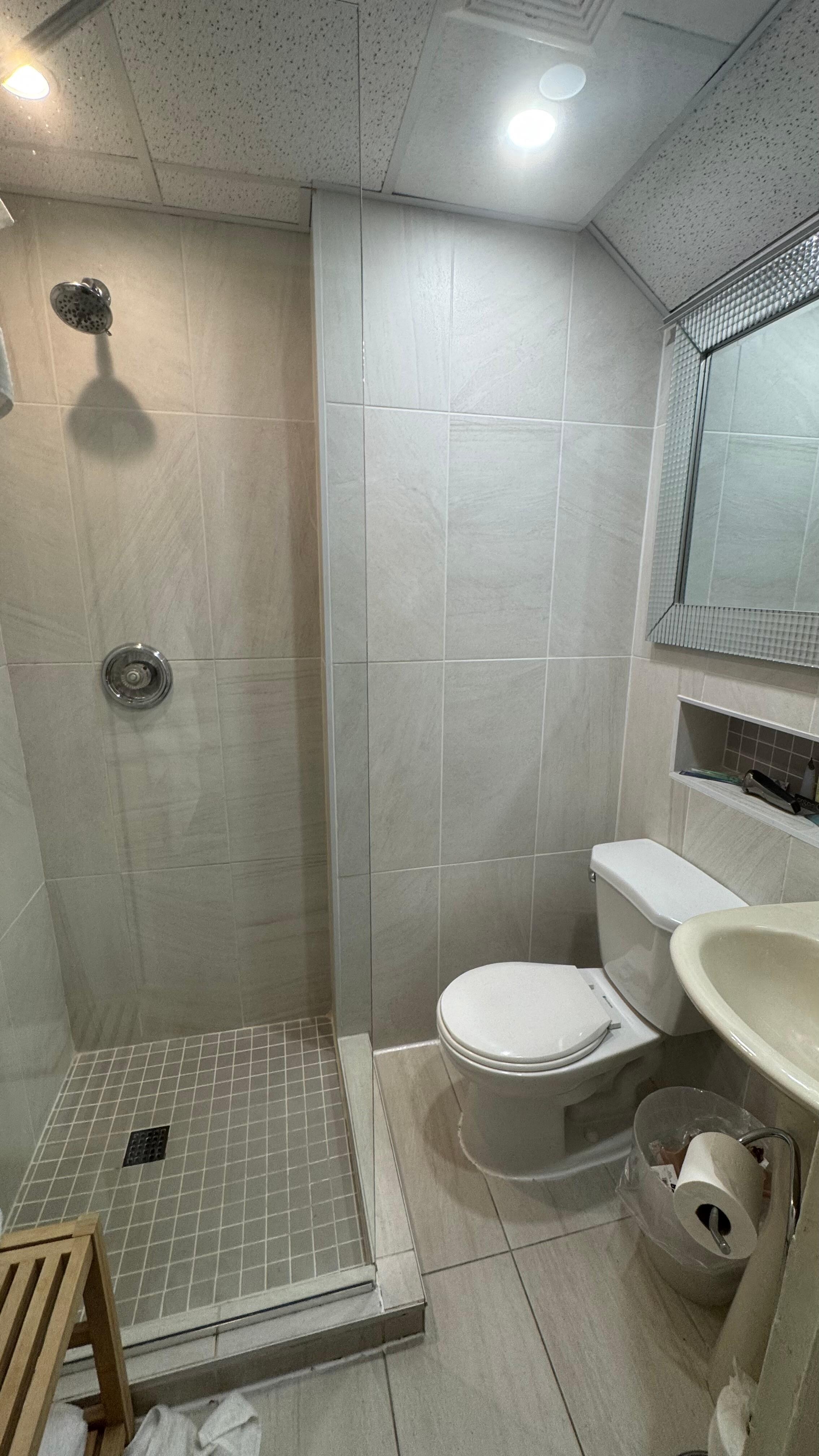 The bathrooms are pretty small. Like if you sit on the toilet, your feet will be in the shower lol