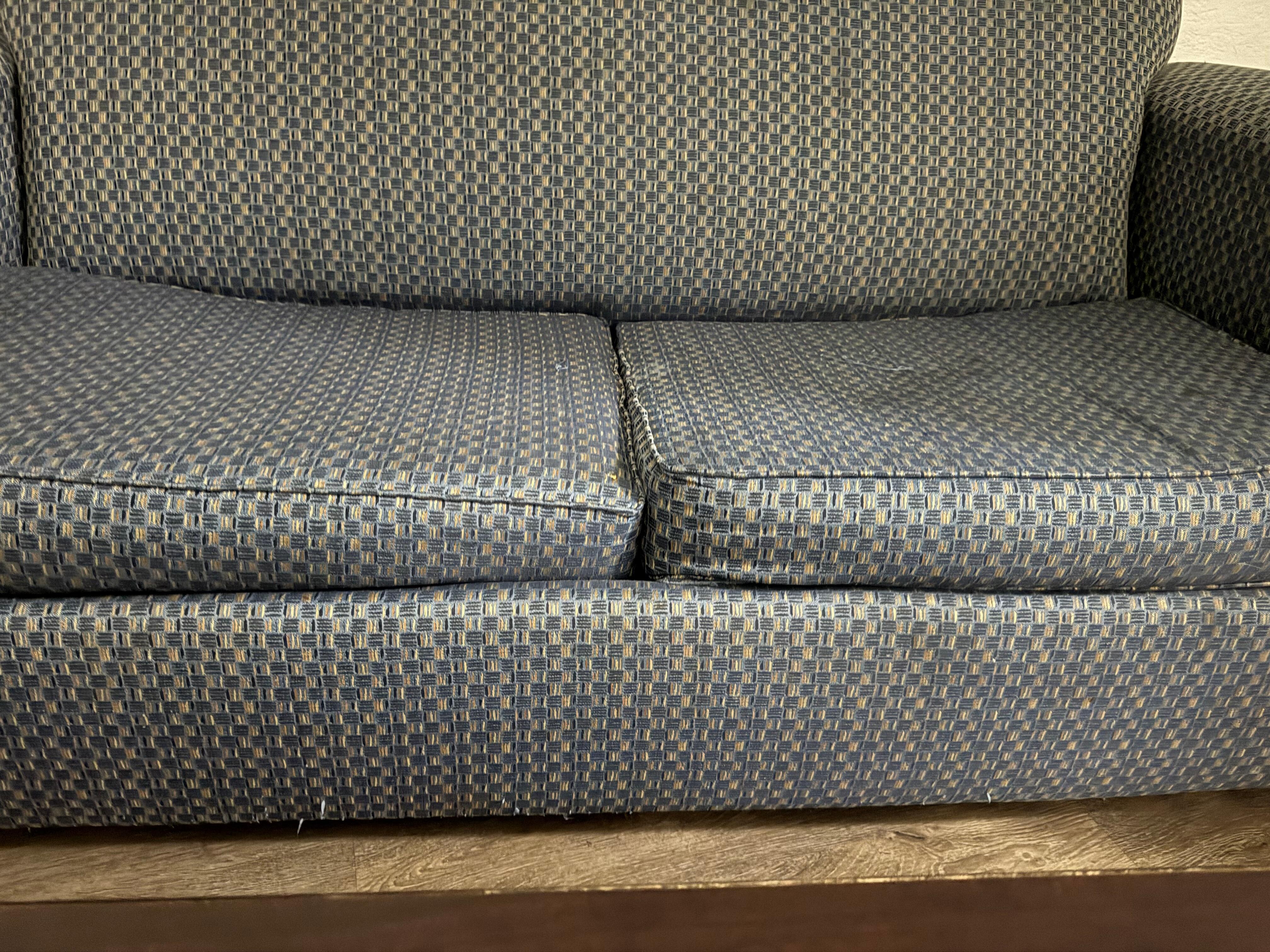 Pretty worn out and stained cushions, frame was lopsided.  