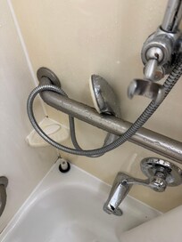 Shower wand with broken holder