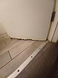 The outside bottom of the bathroom door