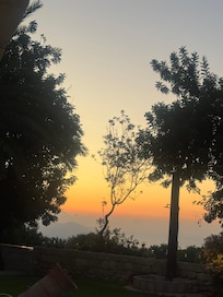 Sunset view overlooking the mountain scenery from the garden