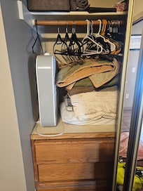 Master closet had no room for hanging clothes or suitcases.