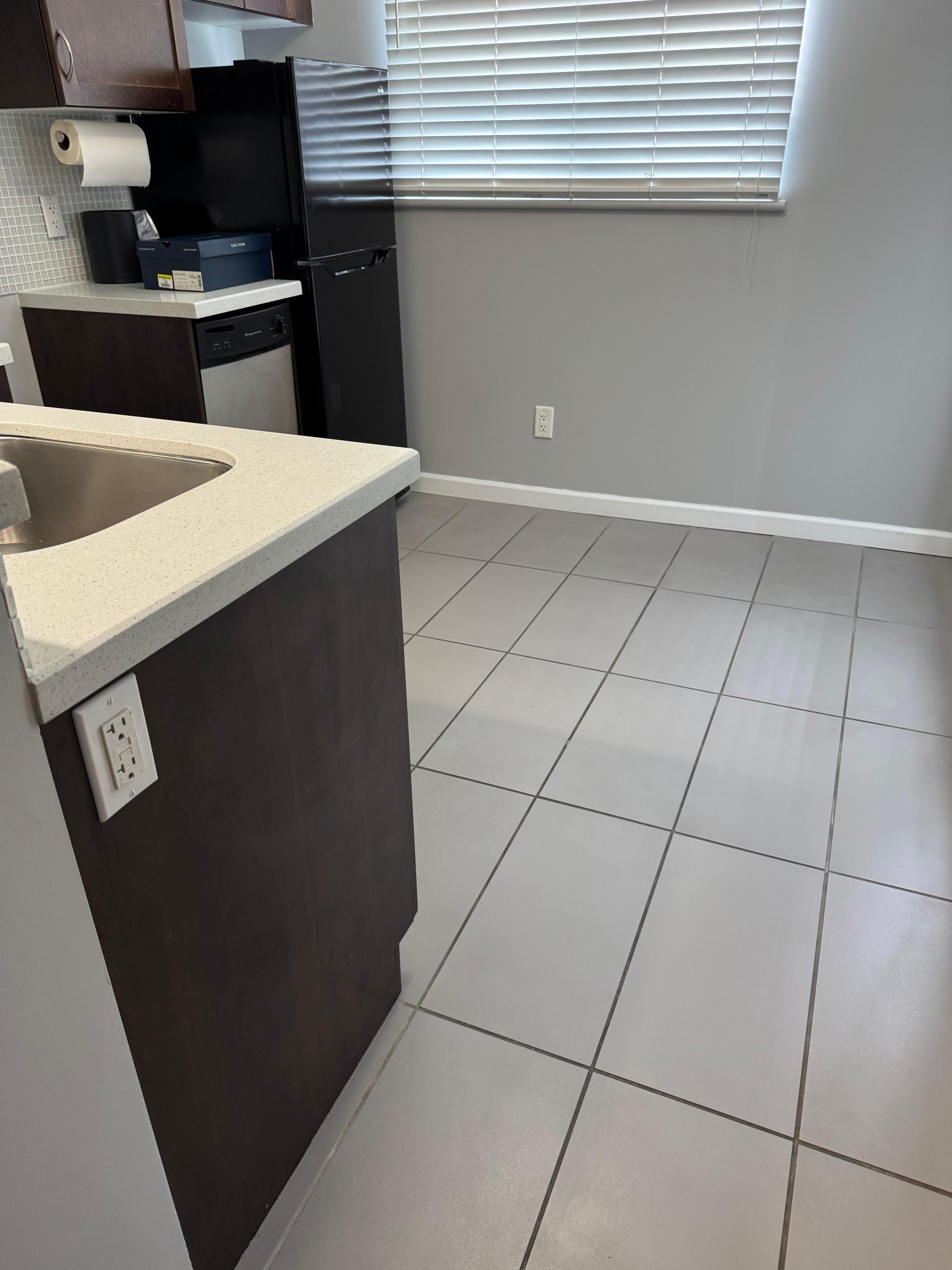 Floor was sticky, and fridge smelled. 