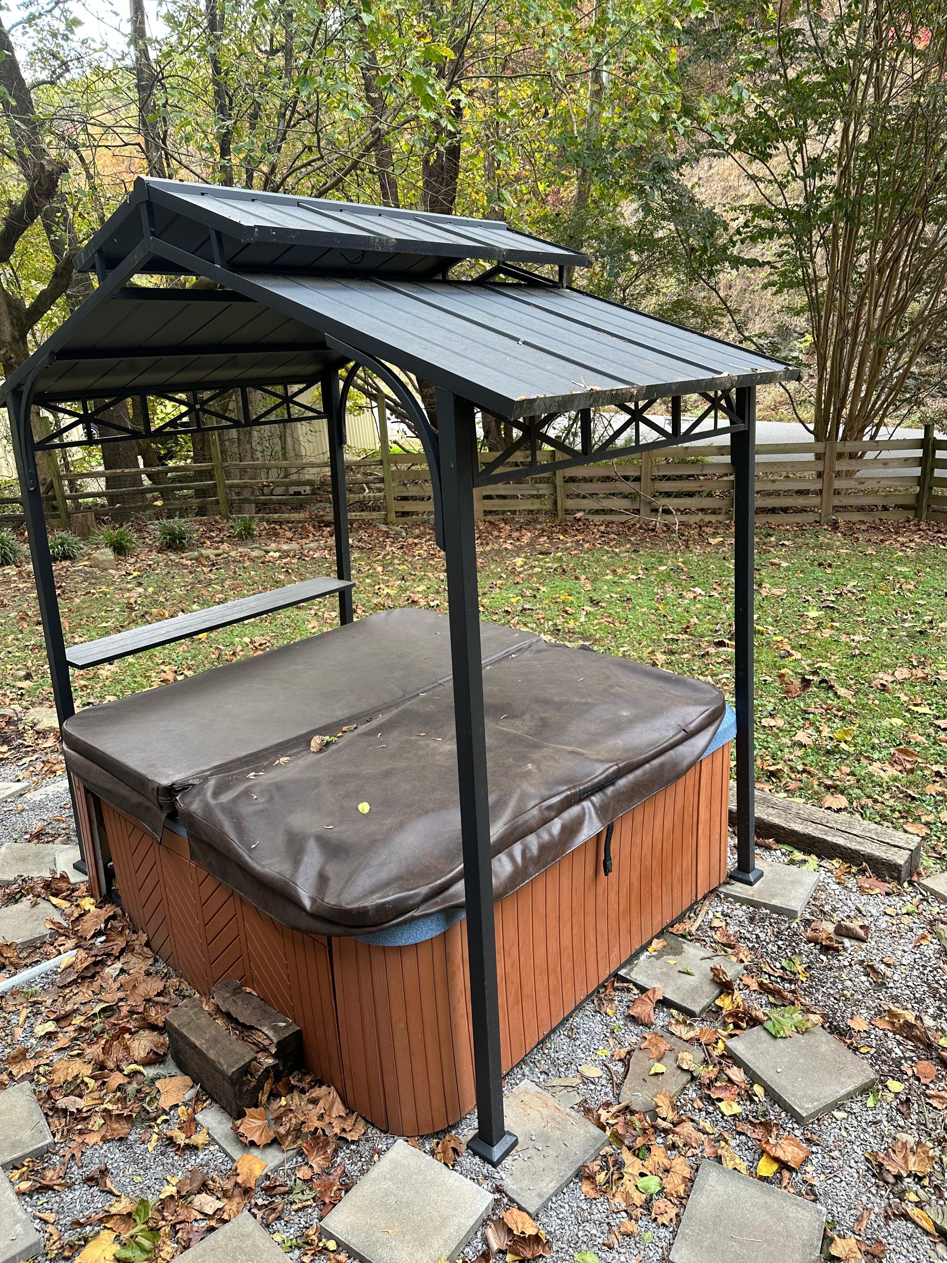 Close to road in the middle of the front yard 