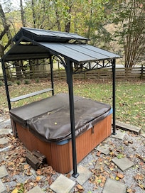 Close to road in the middle of the front yard