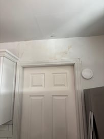 Mold and cracks in kitchen wall/bathroom door
