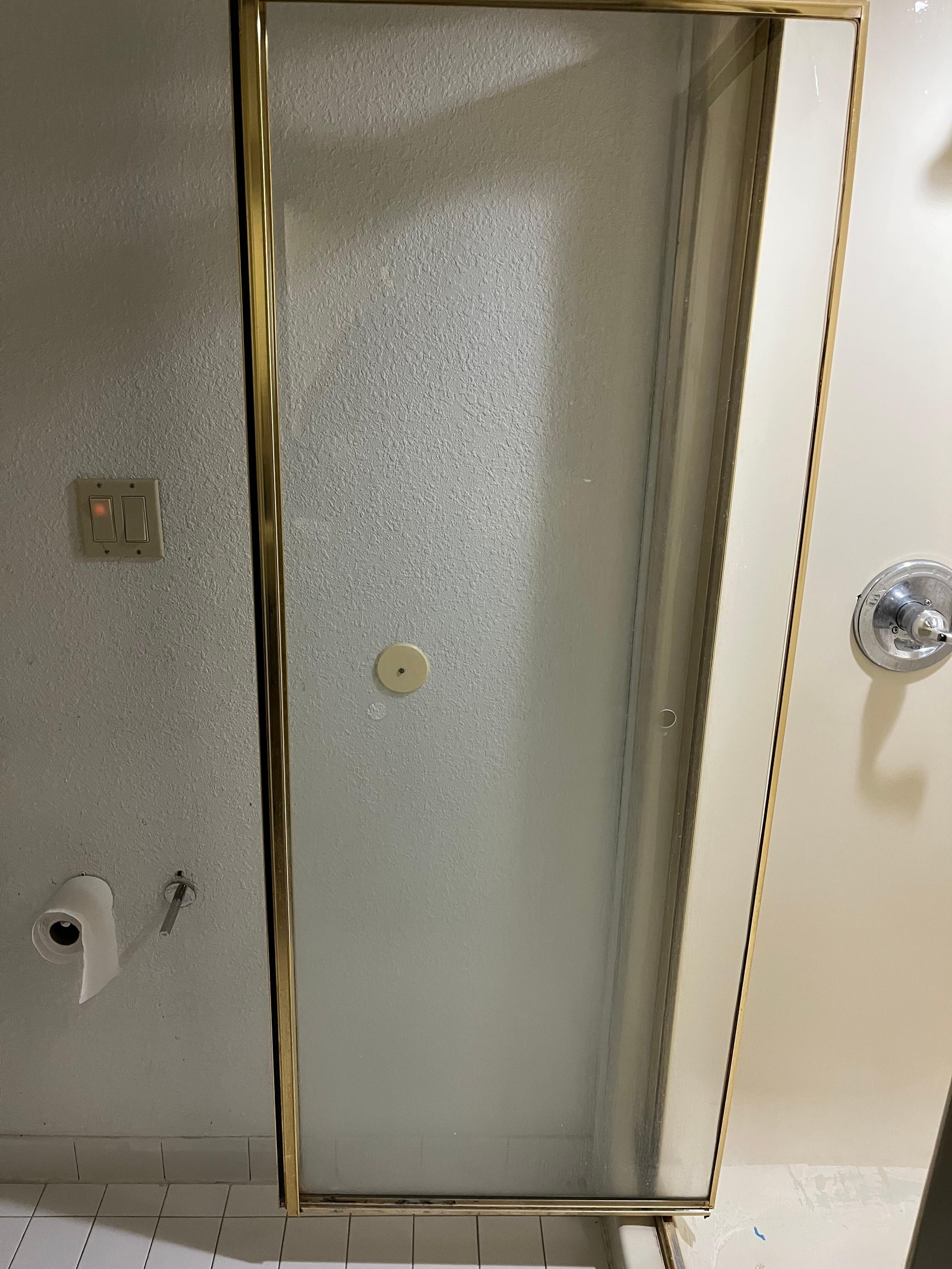 Shower door didn’t have a towel Bar, holes in the glass