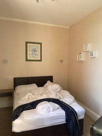 Spacious rooms - 3 singles in one room and a double in the other.