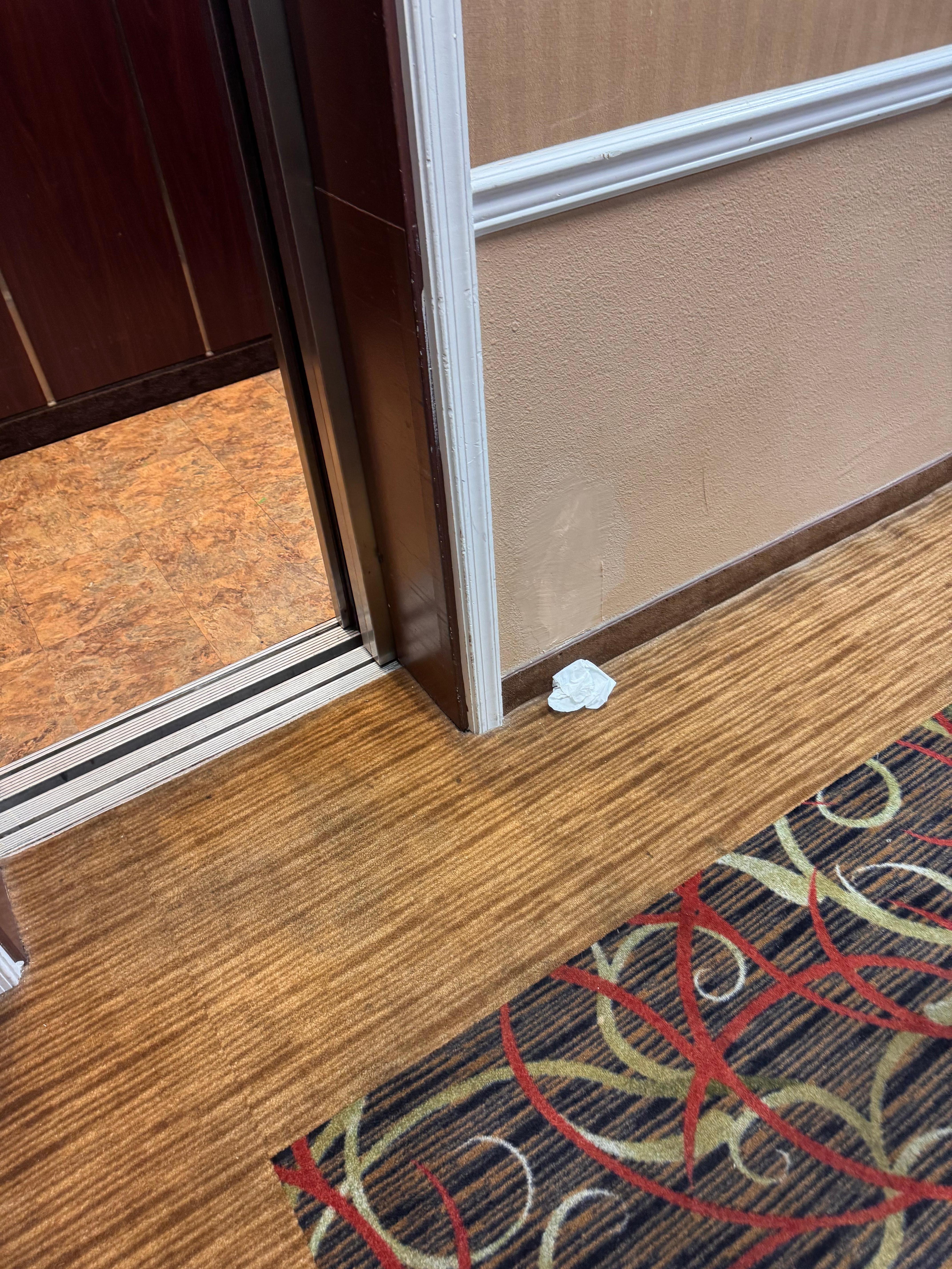 Trash on floor all night and next morning 