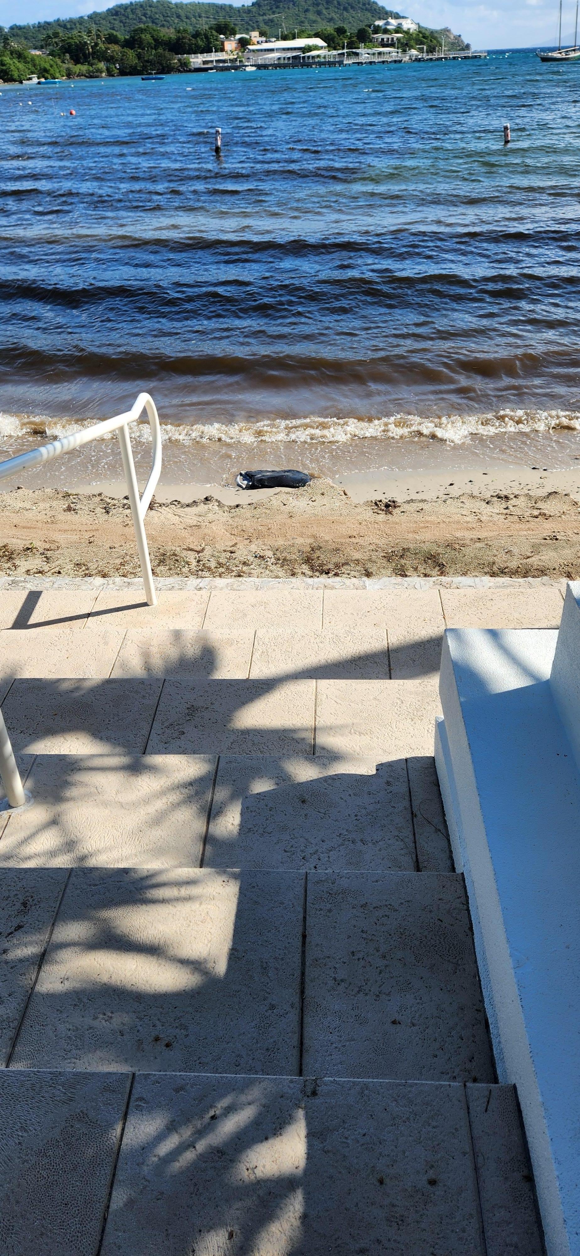 Here is the beach front they speak of!! The water is filthy and smells horrible 