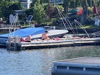 View of the boat dock. Four boats are docked here.