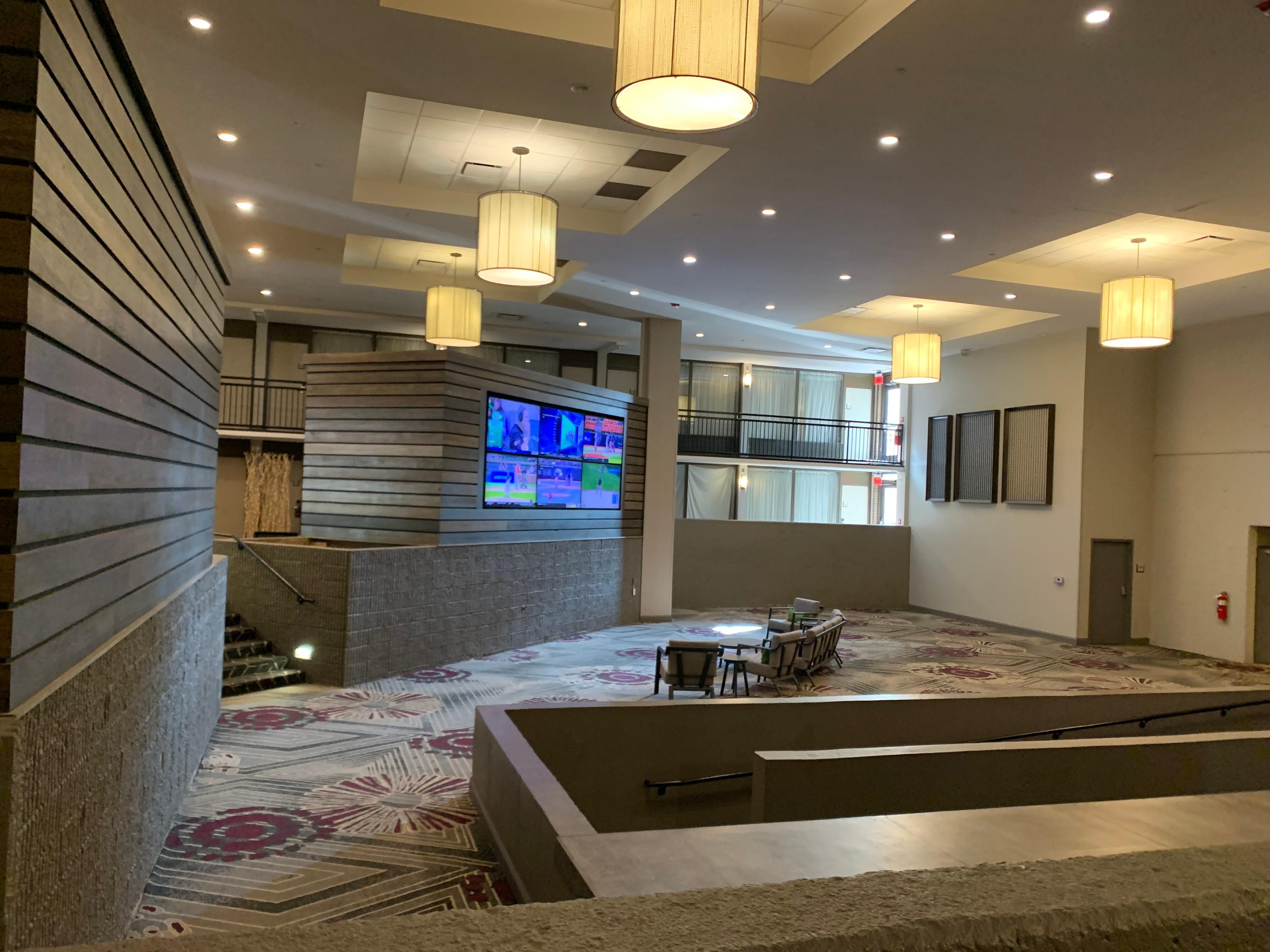 Unique layout with a sports game on each tv