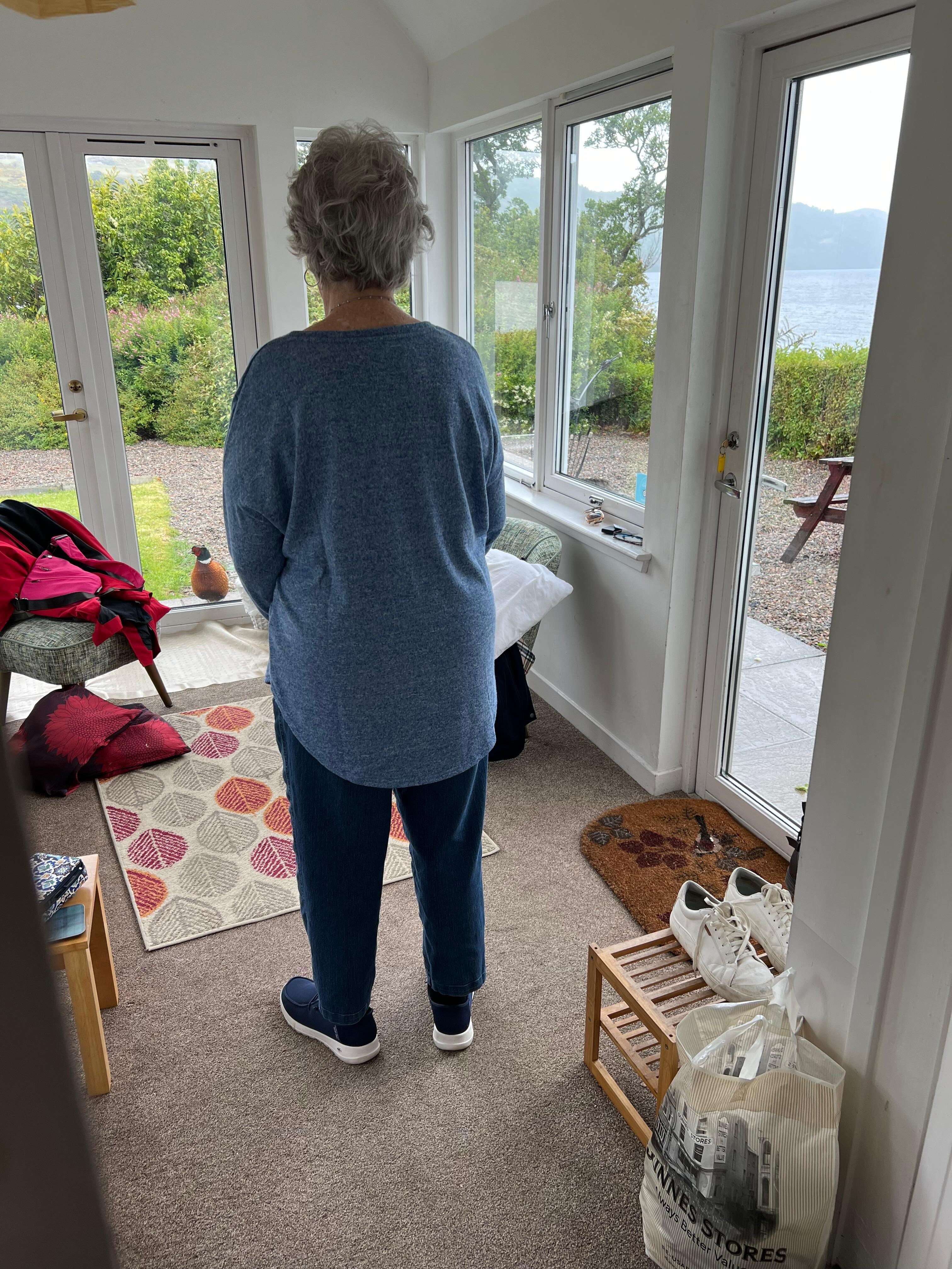 Nonnie talking to the pheasant thru the glass