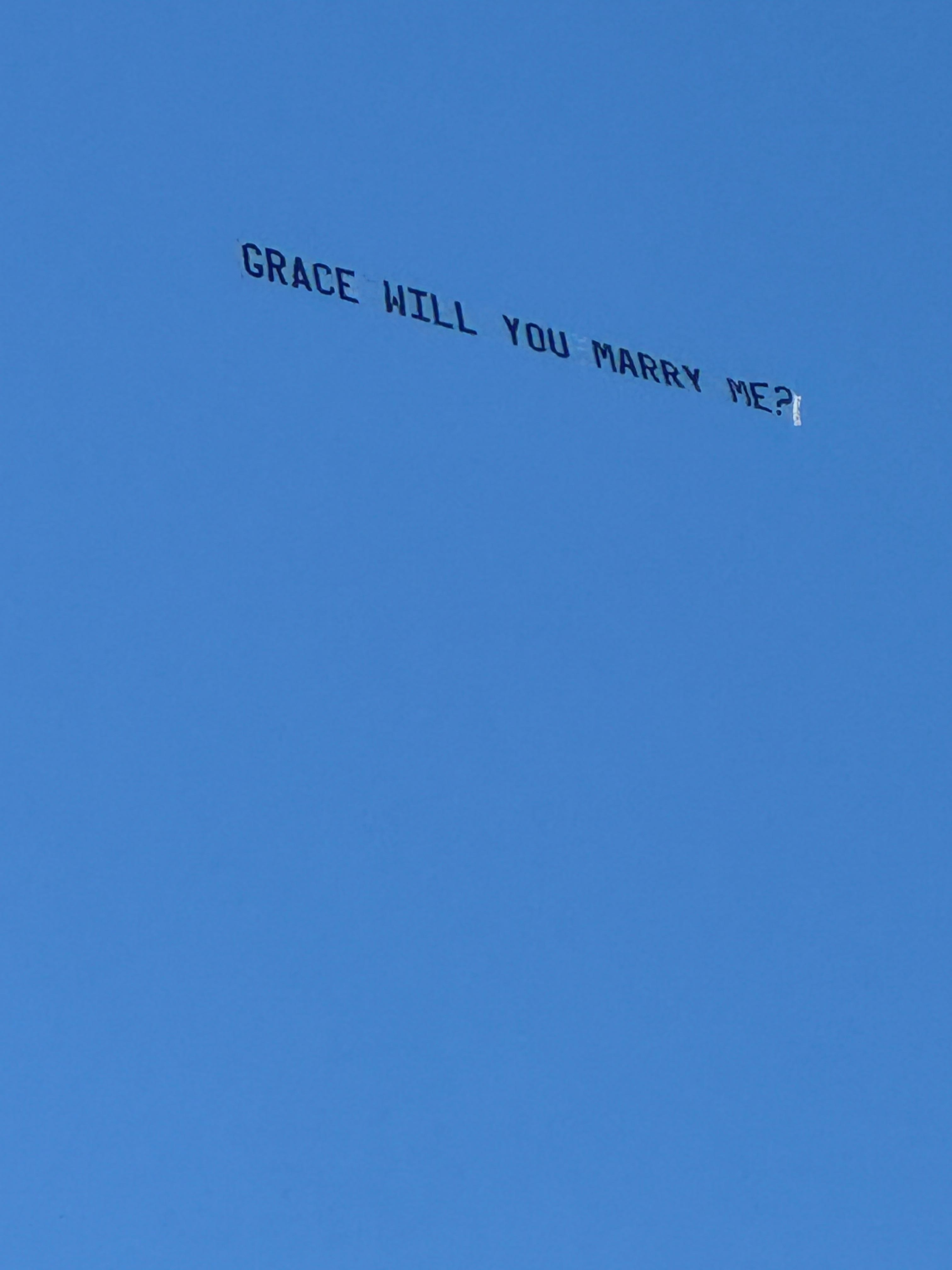 Her fiancé asks her on the beach!!