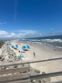 A picture of the beach area in front of the Condo . Taken on the pier .