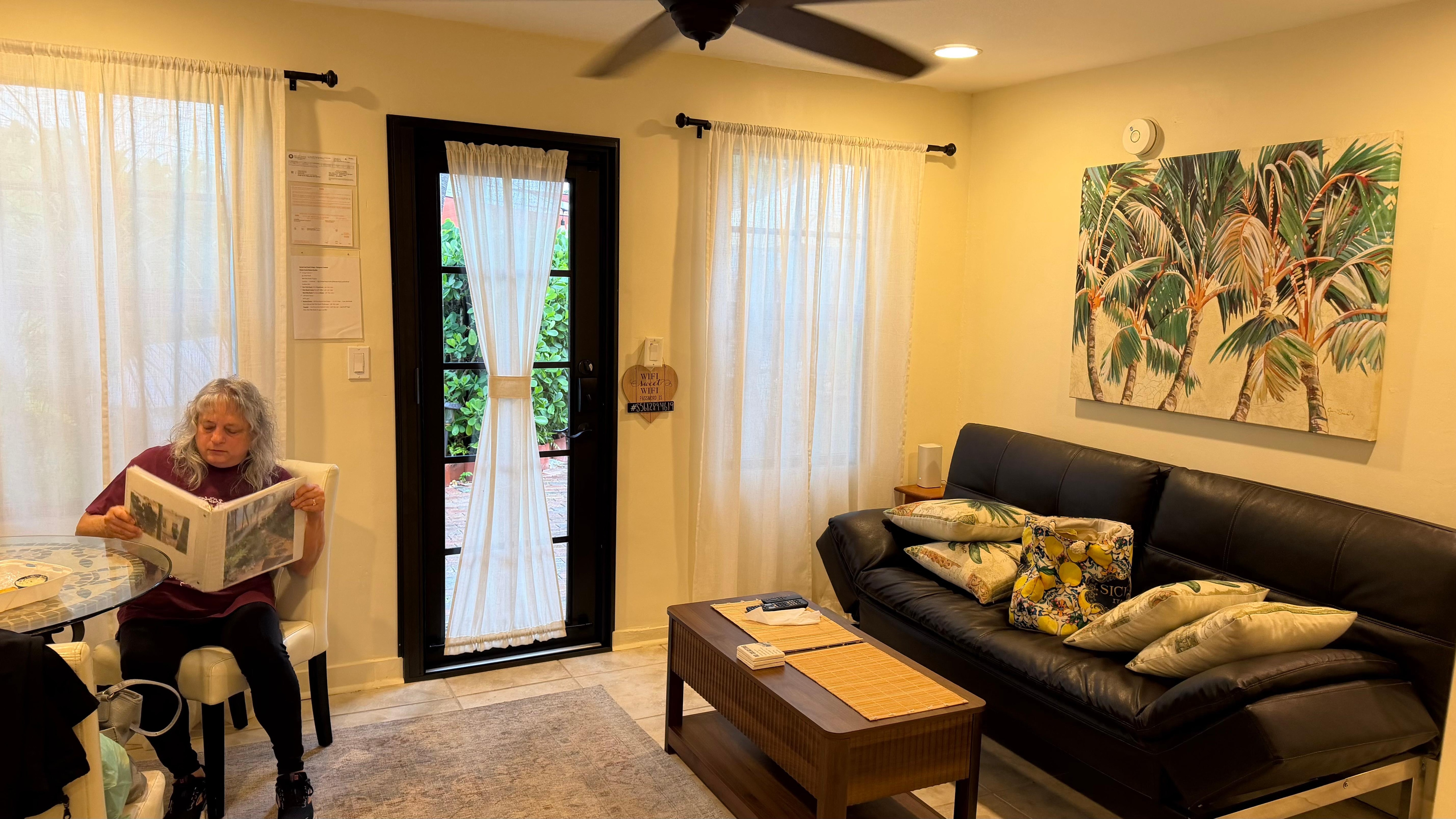 Living and sitting area is comfortable  and has a table for eating or writing and a TV. 