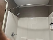 No shower curtain in bathroom