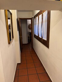 Narrow hallway with a bit of hight restriction between living room and bedroom