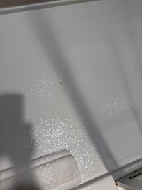 Dust on ceiling over bed
