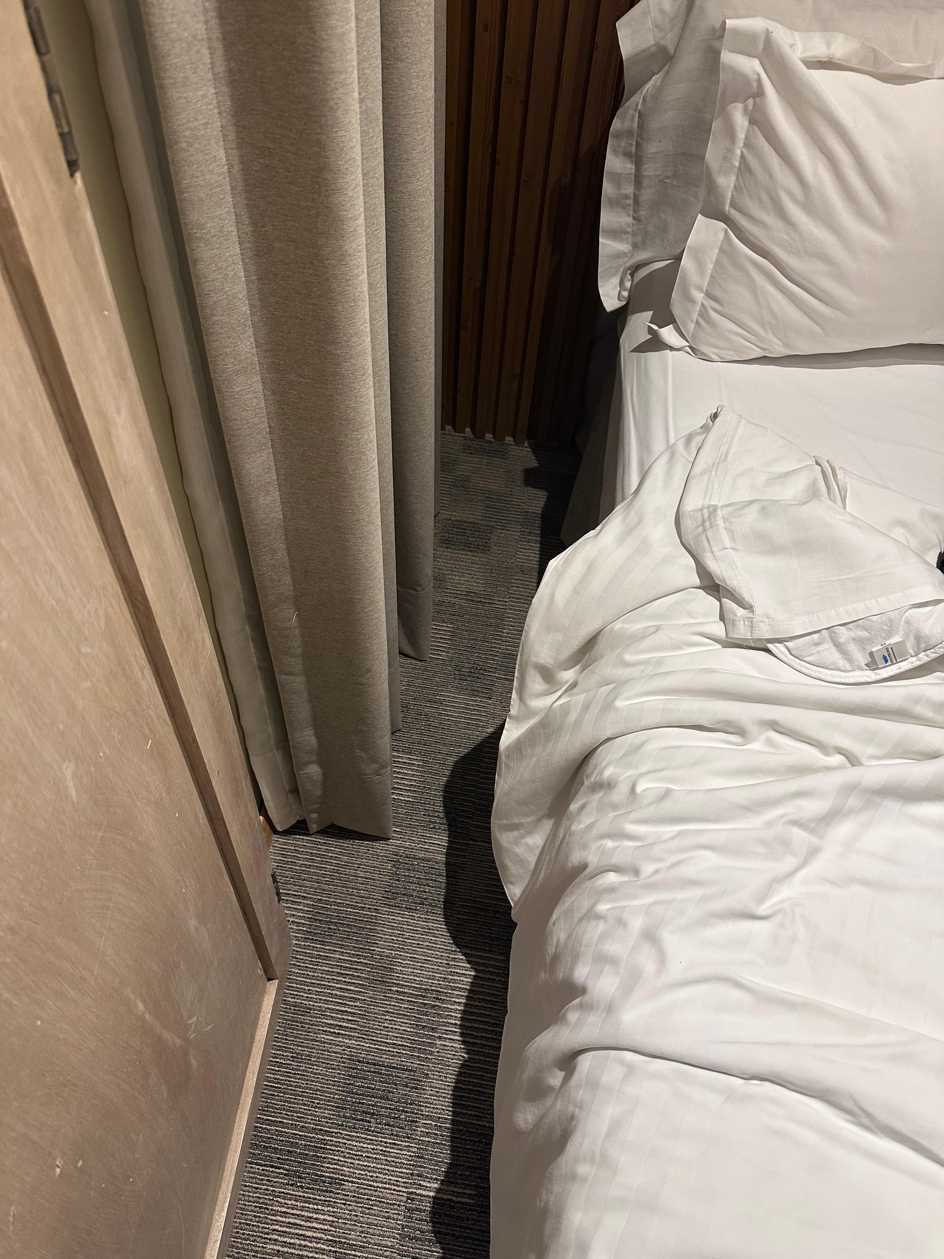Space between bed and wall.