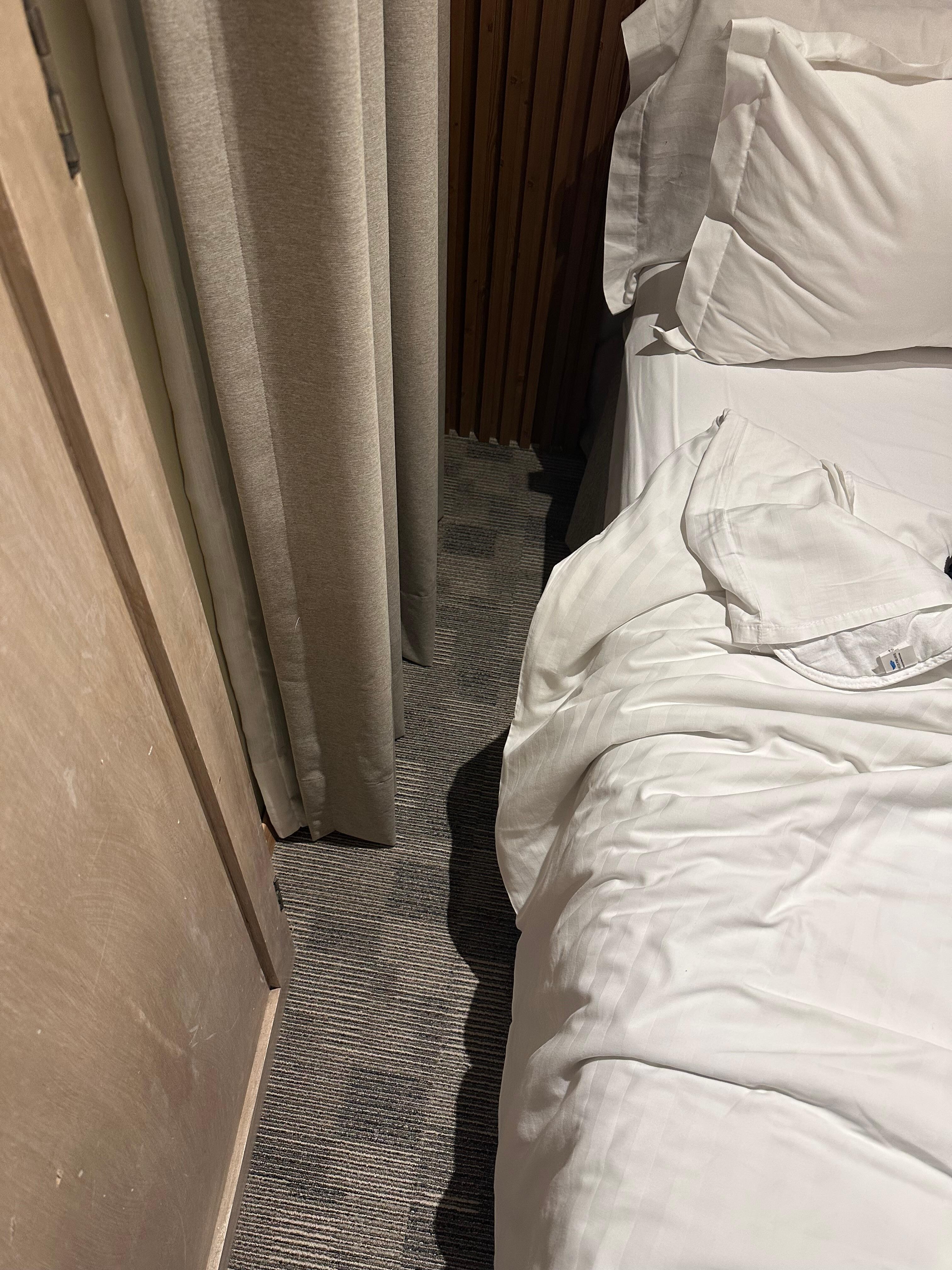 Space between bed and wall. 