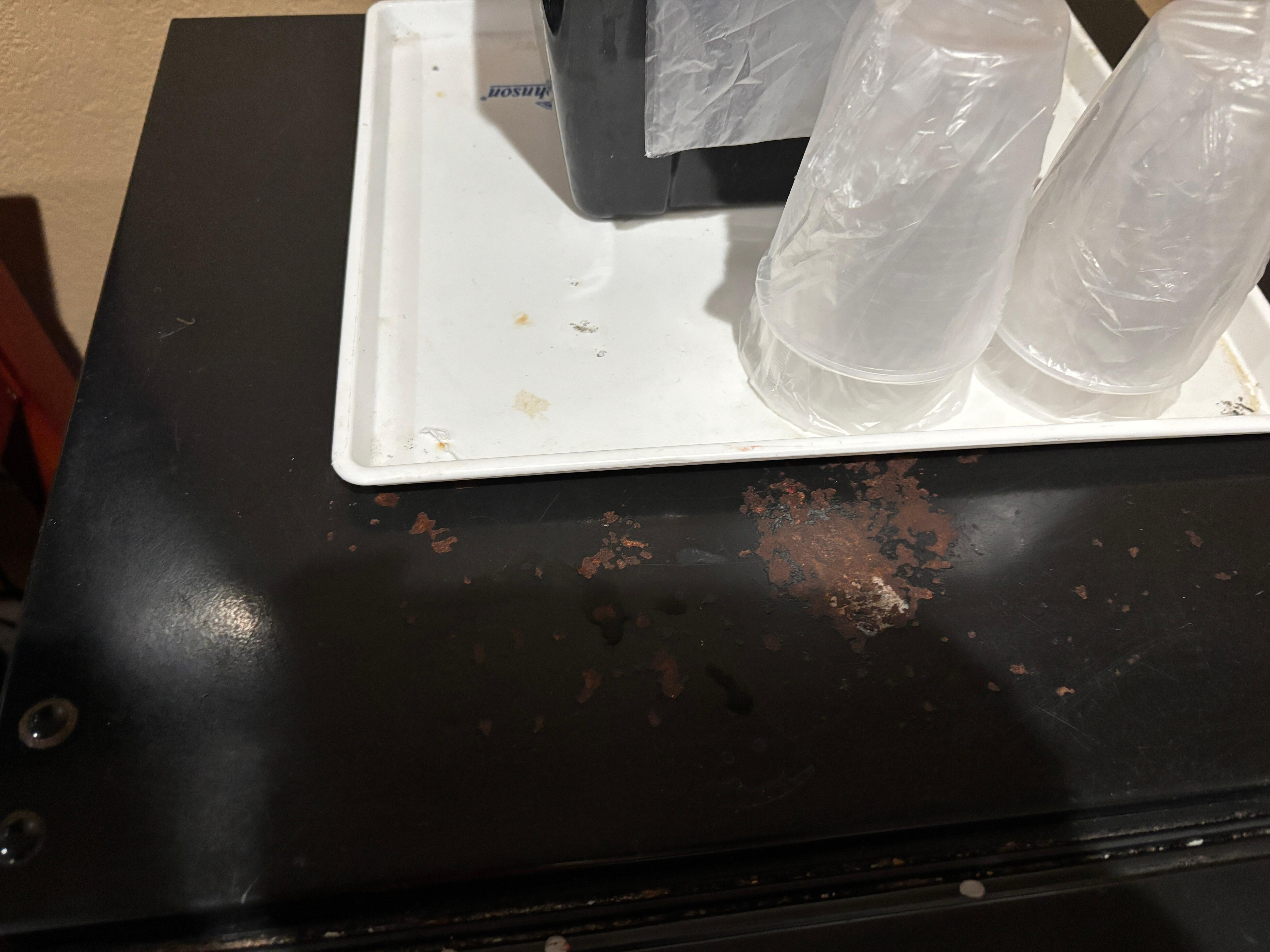 Dirt on tray and fridge 