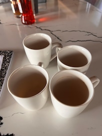 Many dirty mugs, just among some
Of the dirty dishes found everywhere