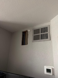 This is the hole in the wall that was made but never filled. Who cuts a whole in the wall and just leaves it. Is this the "home-like amenities" that was advertised on the front end?
