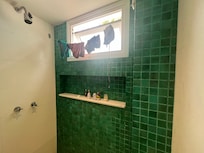 Bathroom with amazing shower and a drying line