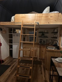 Inside view of kitchen and loft above.