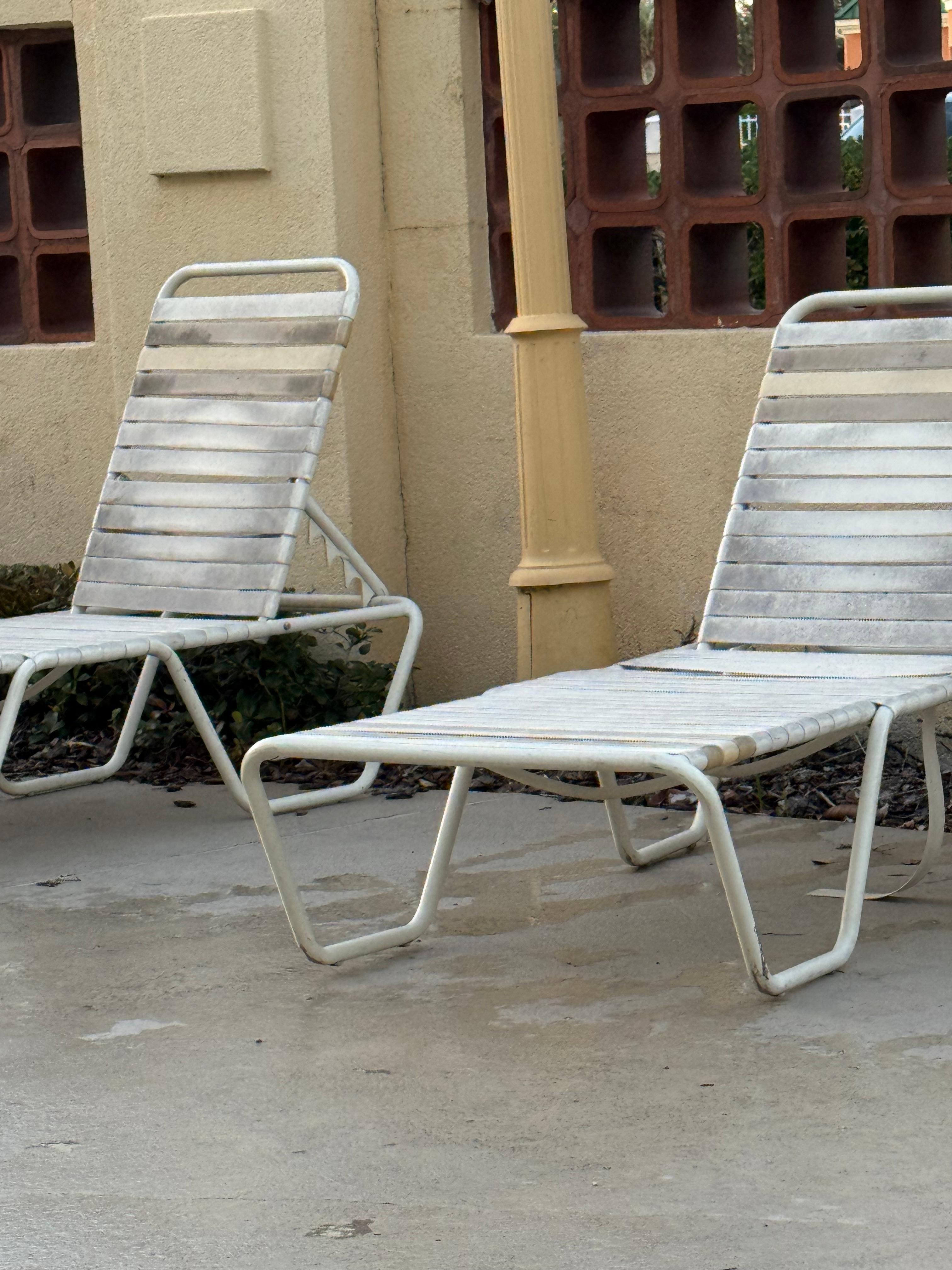 Lawn chairs by pool