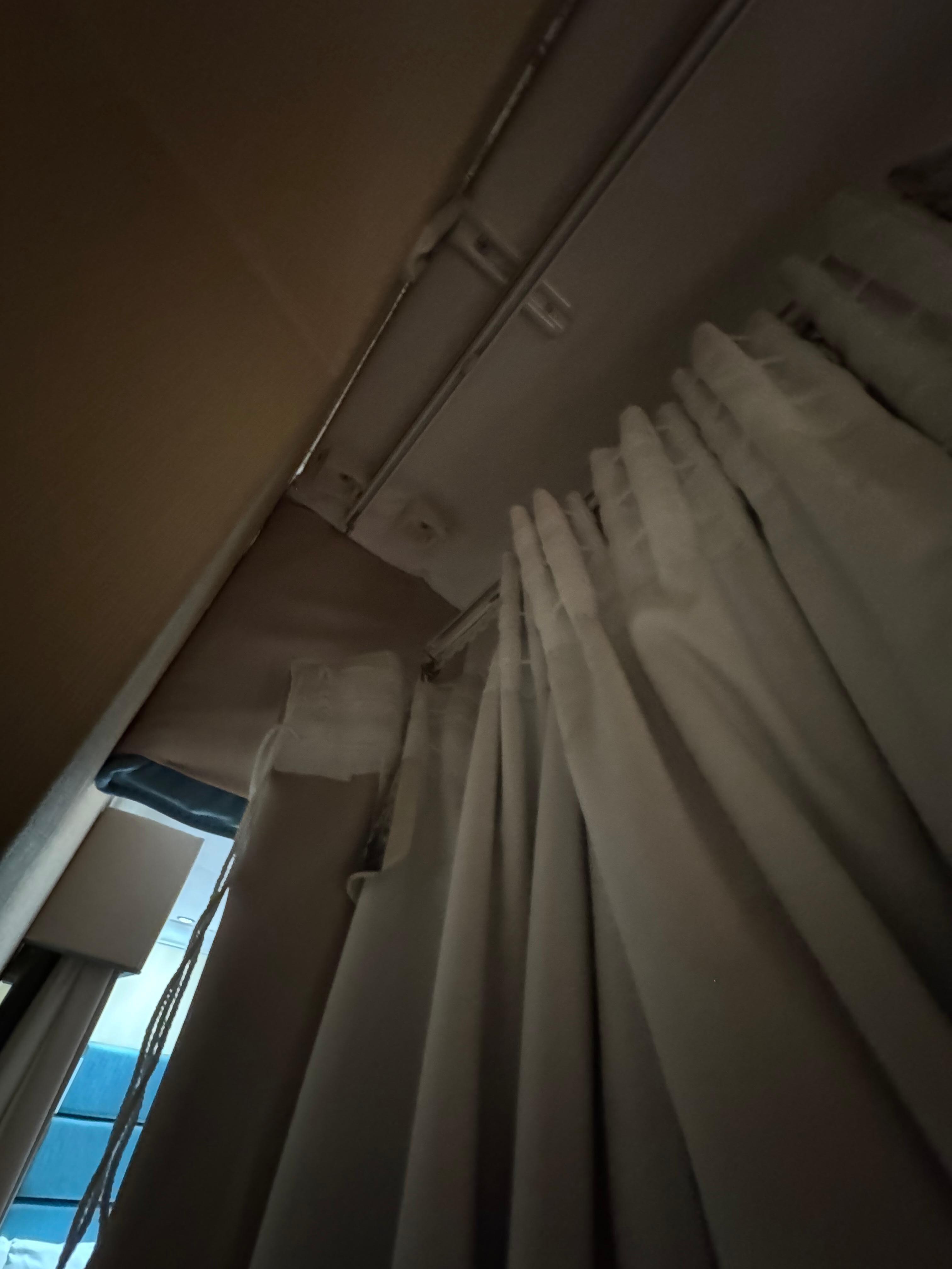 The curtain trail is broken on one end, so the curtain slides to one side and could not cover the windows at night. You see bright light from the streetlamps.