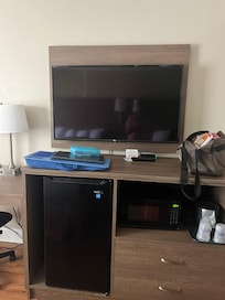 Tv area with microwave and mini fridge