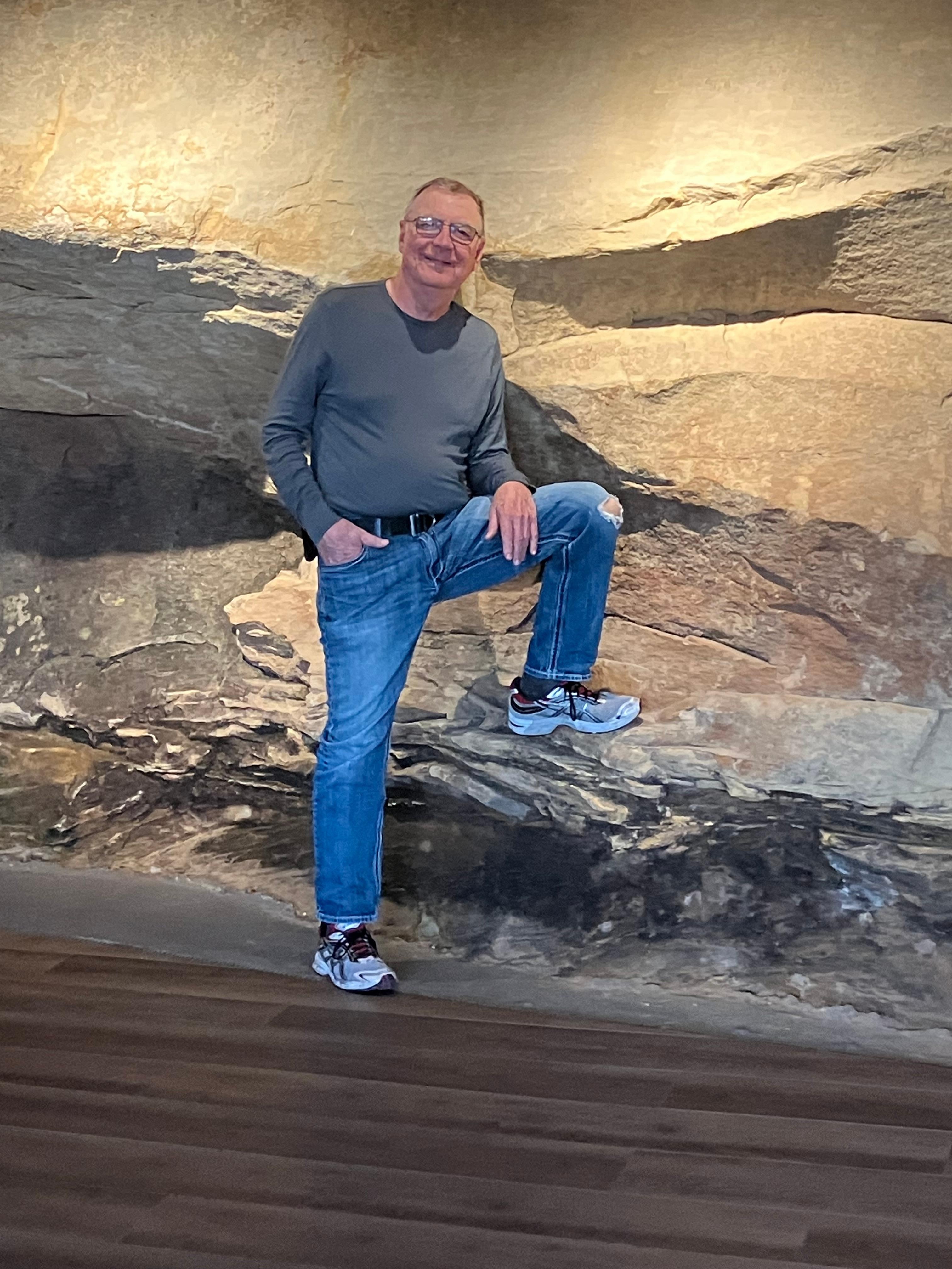 Back wall of rock runs through one or two bathroom, main room and laundry room. An unusual and unique feature especially at night when lit up