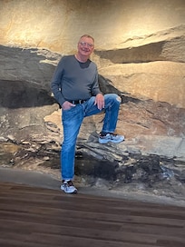 Back wall of rock runs through one or two bathroom, main room and laundry room. An unusual and unique feature especially at night when lit up