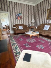 Comfy living room adjacent to the dining room.