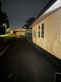 Newly asphalt driveway and large lot