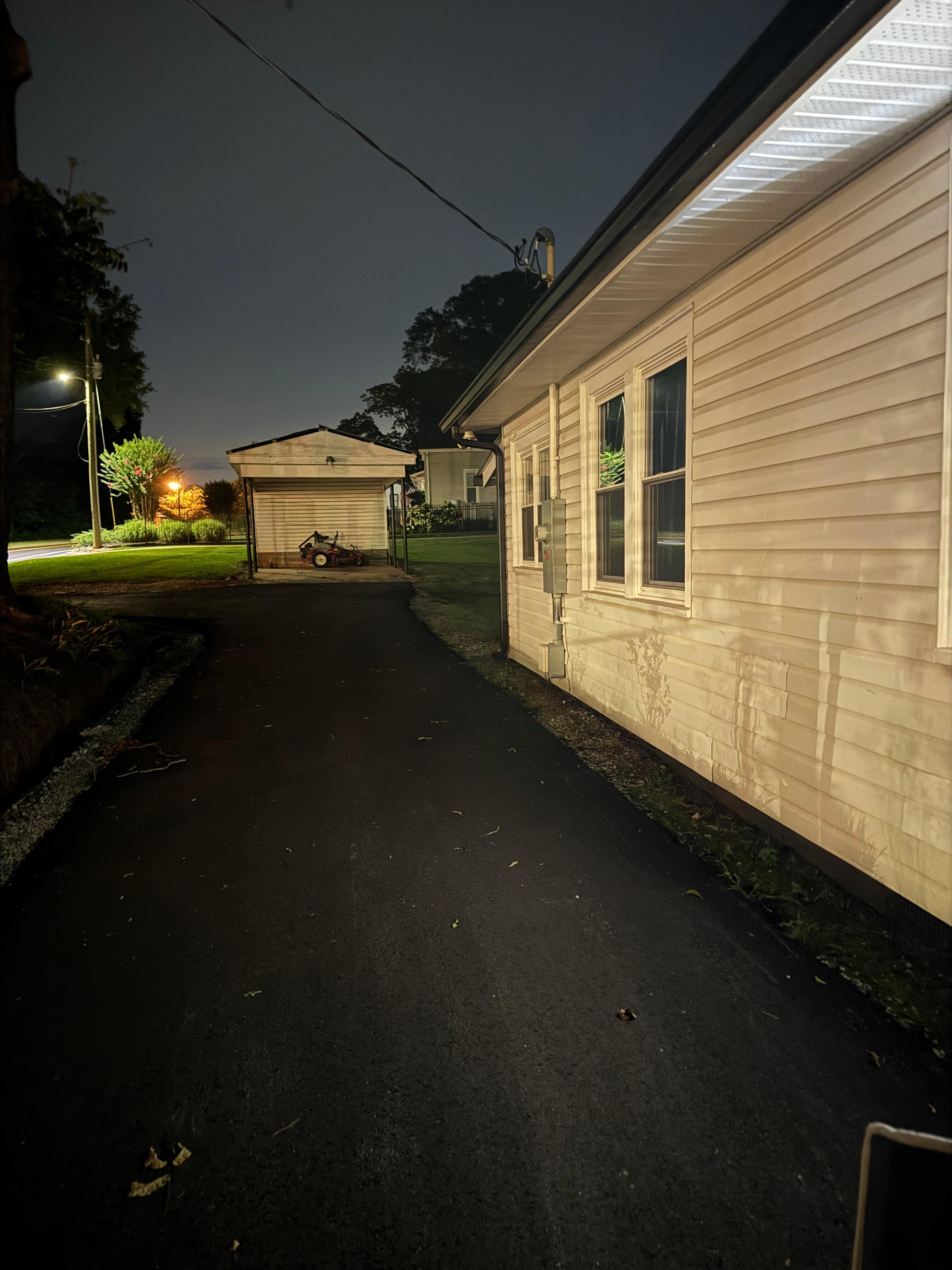 Newly asphalt driveway and large lot