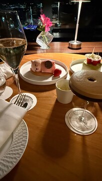 Beautiful lounge and attentive staff. Food was delicious. Dessert was creative art. Amazing views