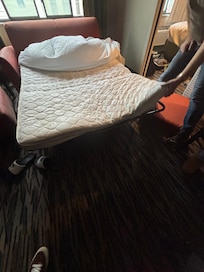 Sofa all broken with only partial wire holding half together.