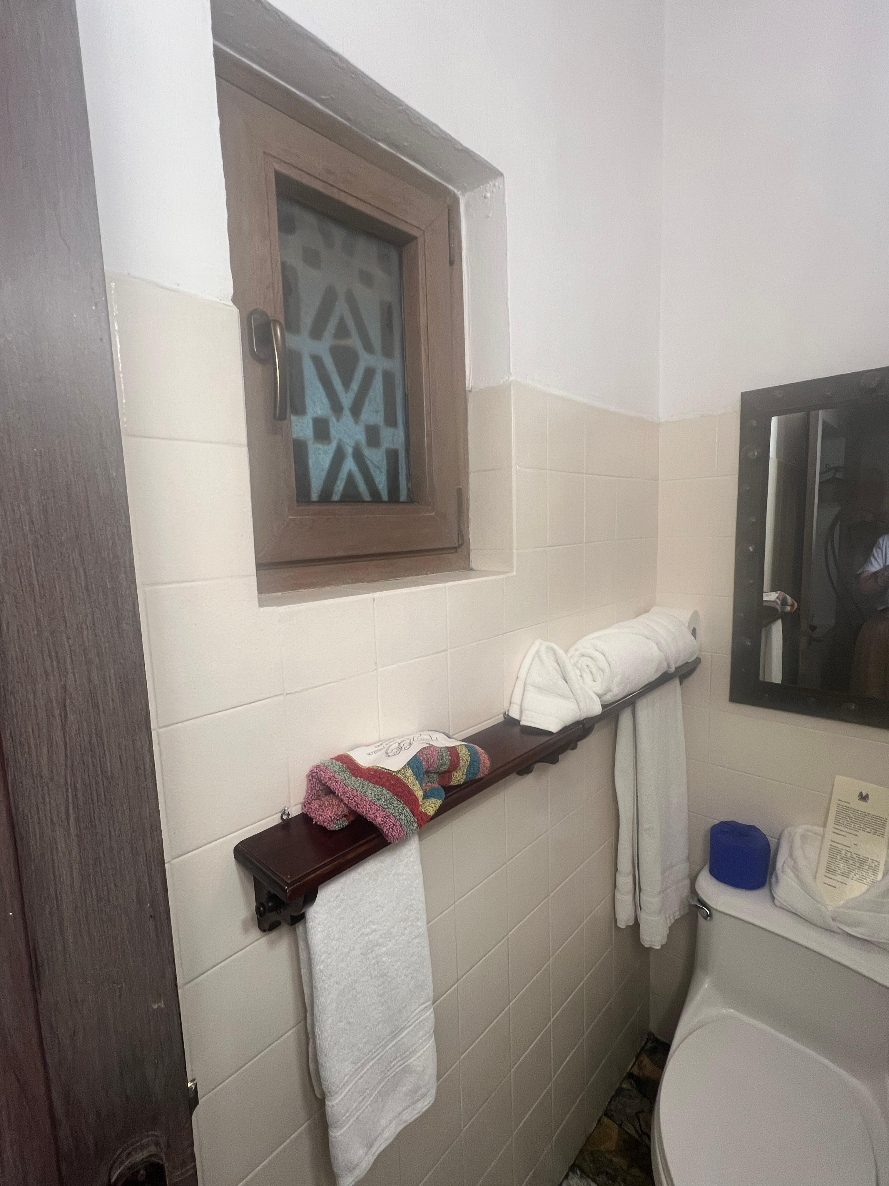 Bathroom window gives on restaurant 