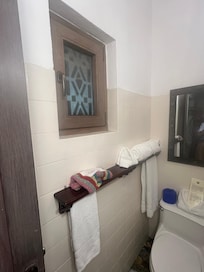 Bathroom window gives on restaurant