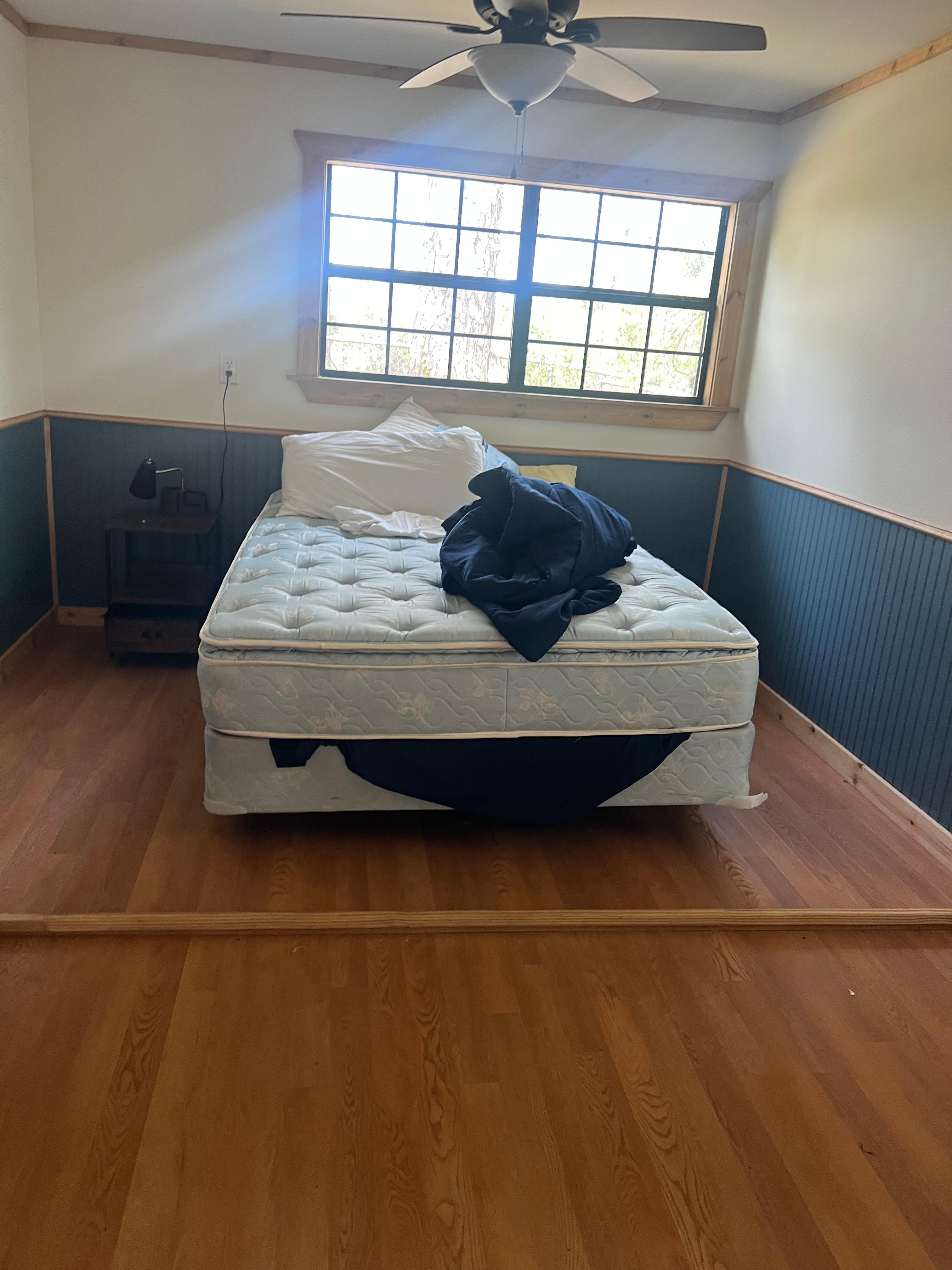 unmade and crooked bed