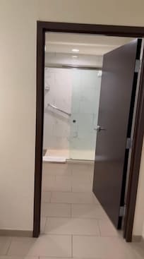 Very spacious shower the sink was in another spacious area