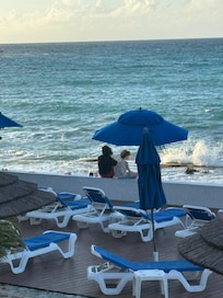 The deck between the ocean and the beachfront rooms.